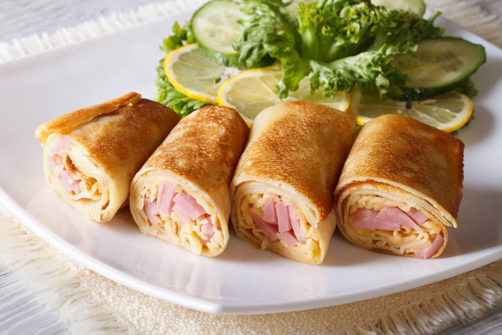 Involtini di crespelle prosciutto e formaggio, la ricetta facile