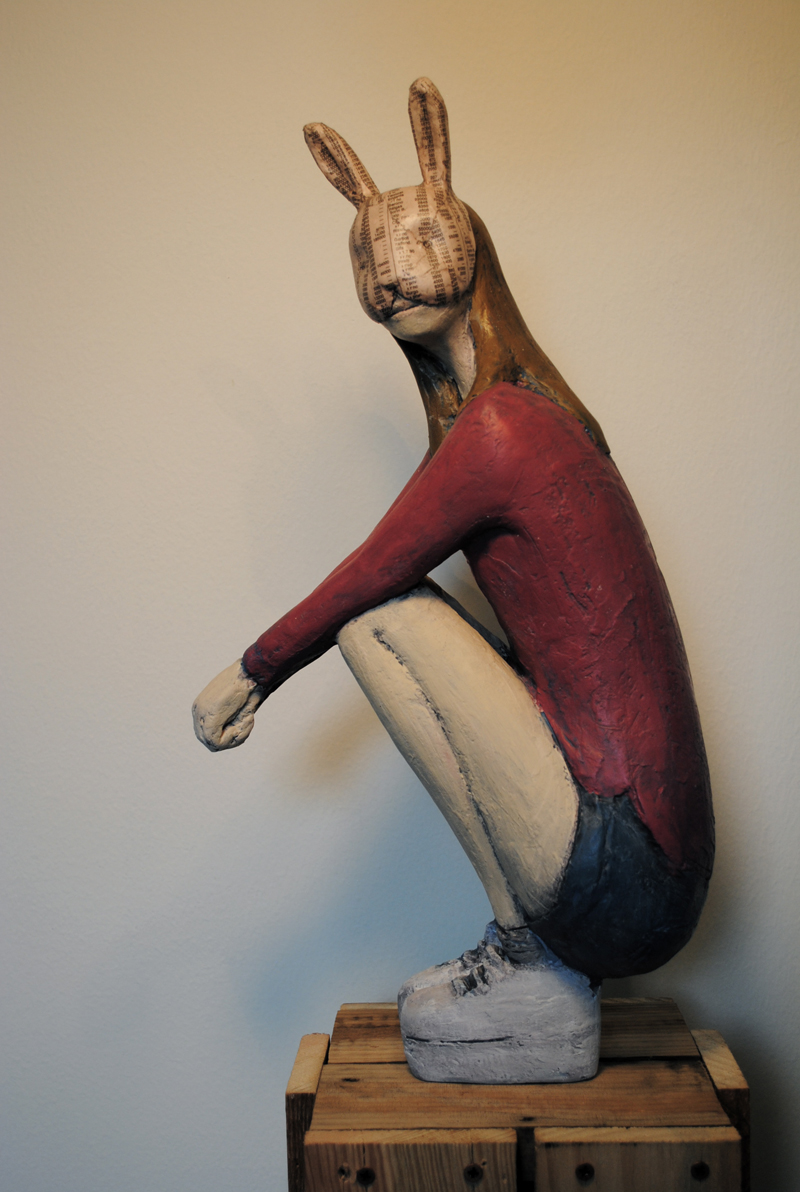 Sitting_rabbit_girl_-_bestie_quotidiane_series_painted_resin_news_paper_51x26x15cm_2014_painted_resin_news_paper_51x26x15cm_2014_.jpg
