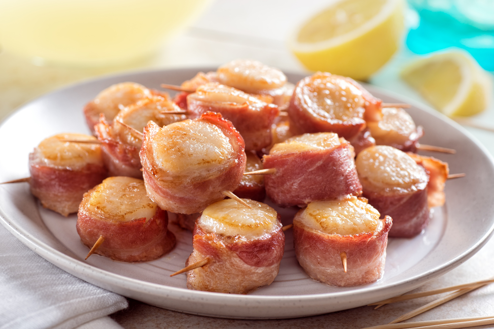 Capesante avvolte nella pancetta: l’antipasto più raffinato